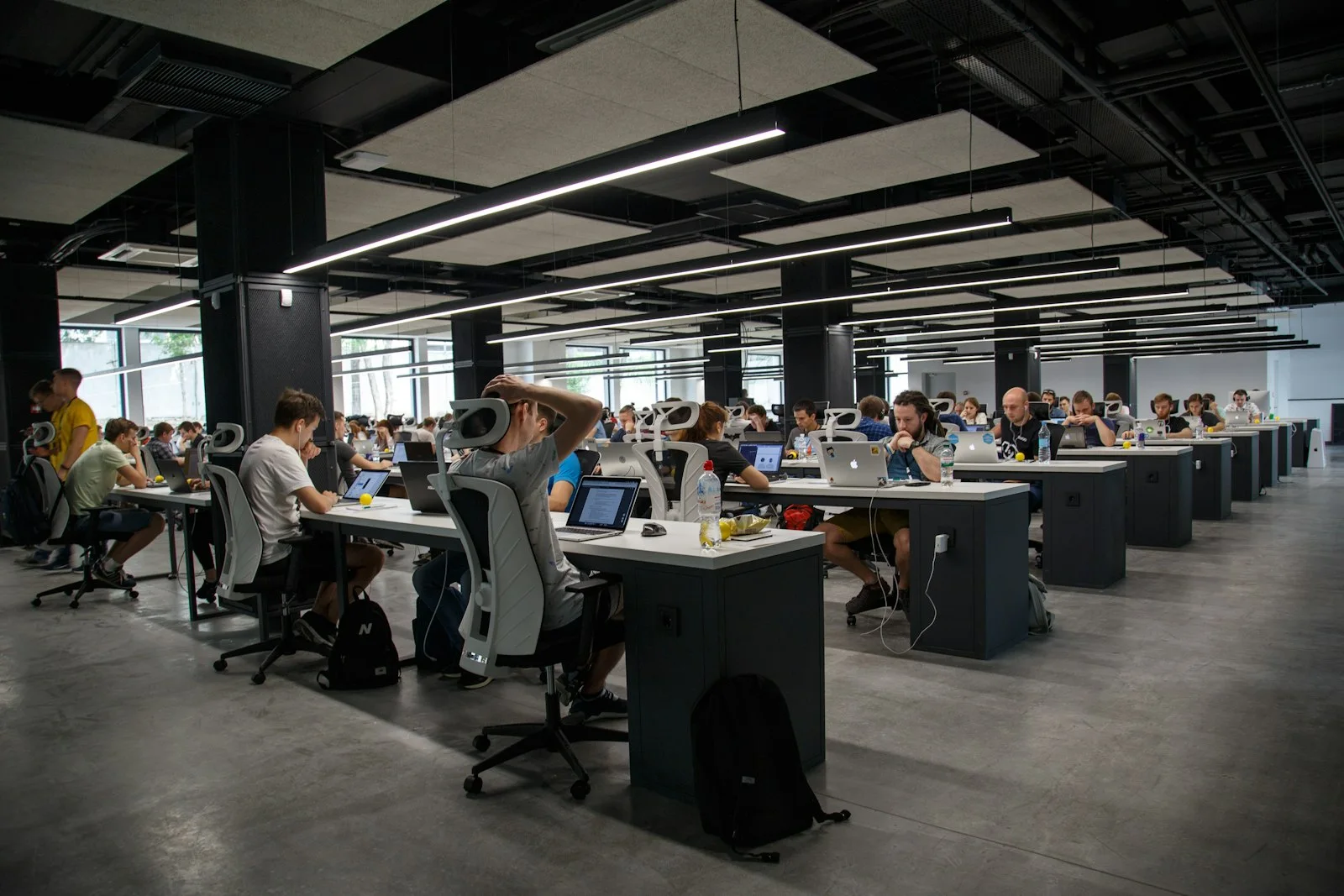 Person at a desk with phone set aside, suggesting a break from endless swiping
